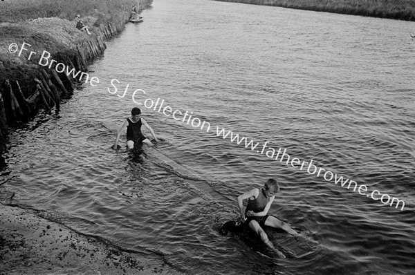 BOYS AT BOATERS HILL THE RAFT WITH FRYING PANS FOR PADDLES